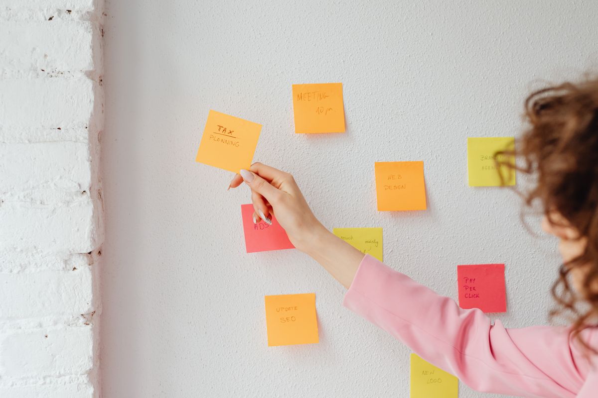 Person working with notes while developing a plan